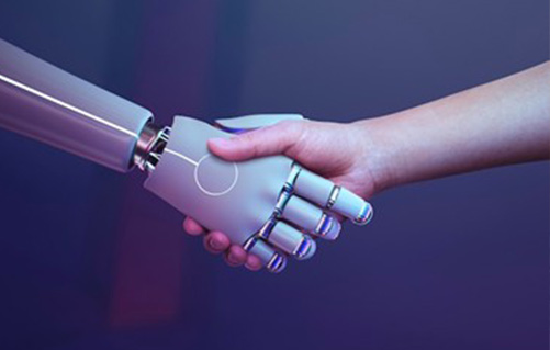 Two people shaking hands in office